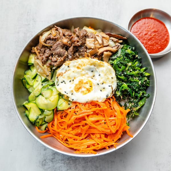 Naju Tofu's bibimbap with beef, egg, zucchini, carrots, spinach, and mushrooms, with gochujang.